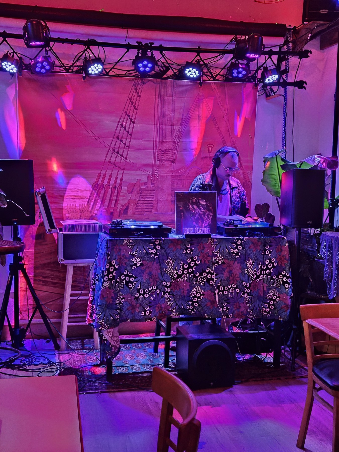 Ben Meyer DJing with blue, pink, and purple lights